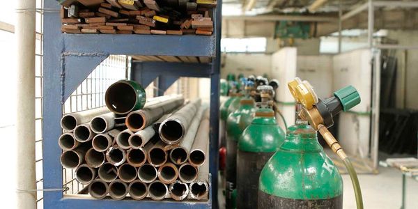 Construction materials warehouse with heavy equipment and organized storage