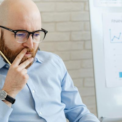 Male analyst reviewing logistics data with focused expression